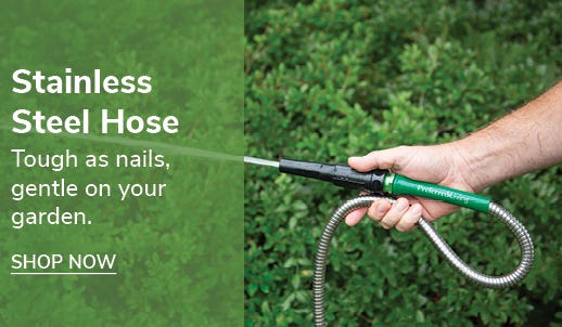 100' Stainless Steel Garden Hose in use in yard