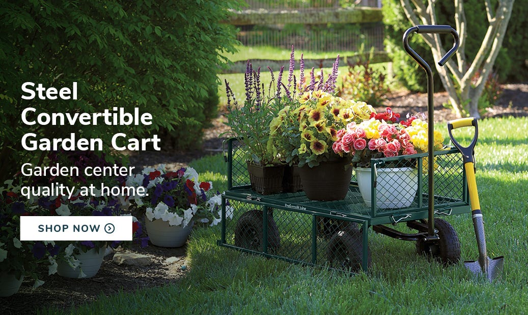 Steel Convertible Garden Cart in backyard setting with plants