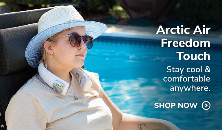 Arctic Air™ Freedom Touch personal cooling system in sue on model in front of pool