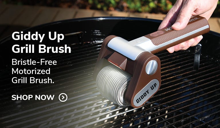 Horsepower Giddy Up Grill Brush in use on outdoor grill