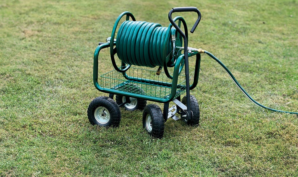 Steerable Hose Cart sitting on grass with hose attached