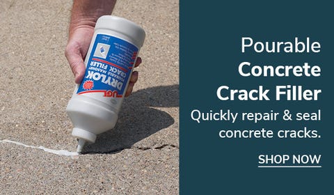 person filling a crack with the concrete crack filler