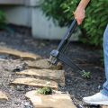 removing weeds in between rocks  thumbnail