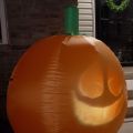 side view of Inflatable Talking Pumpkin  lite up at night thumbnail