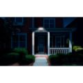 Security Flood light on gutter at night showing lighted front door entrance thumbnail