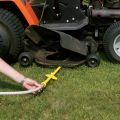 cleaner going under a riding mower thumbnail
