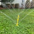Mower cleaner spraying in grass thumbnail