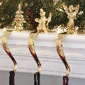 Brass Christmas Stocking Holders on mantel thumbnail