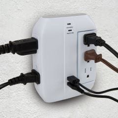 surge protector with cords and USB plugged in 