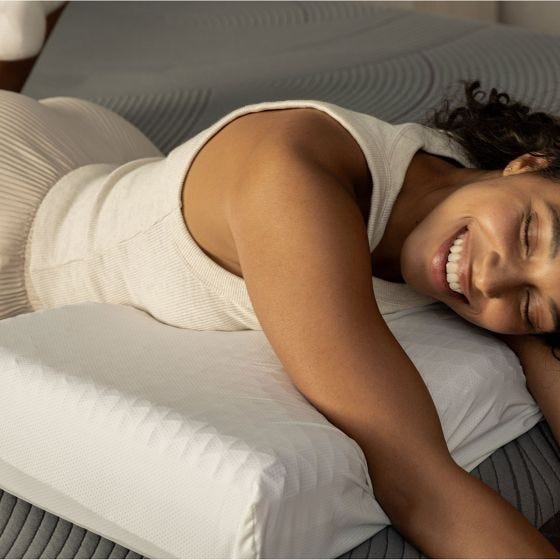 model laying with pillow 