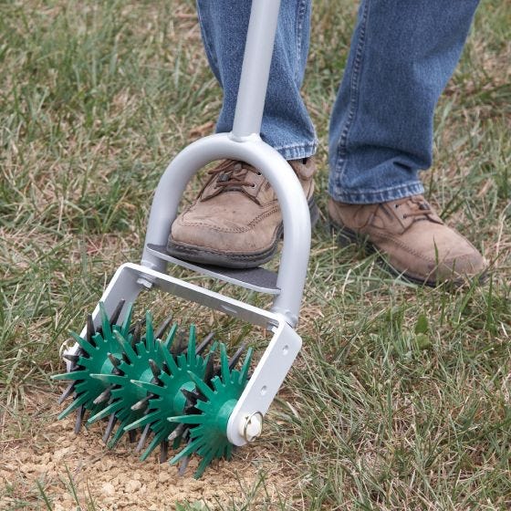 close up view of seed stitcher in yard