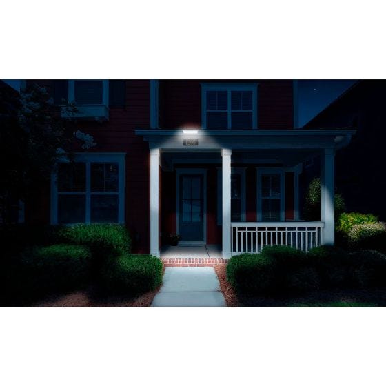 Security Flood light on gutter at night showing lighted front door entrance