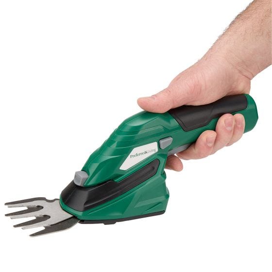 up close hand holding trimmer 