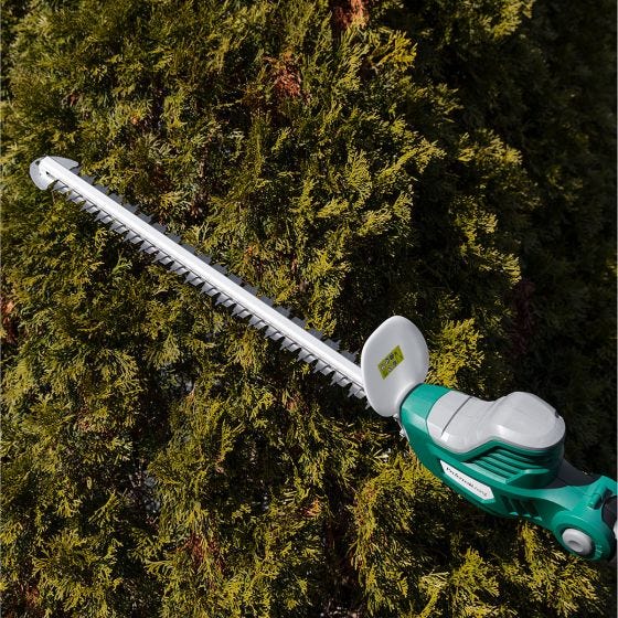 hedge trimmer in use