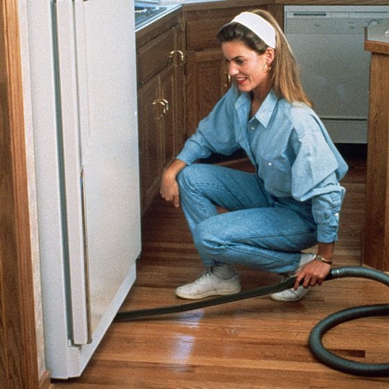 model using the vacuum attachment under the refrigerator model using the vacuum attachment under the refrigerator