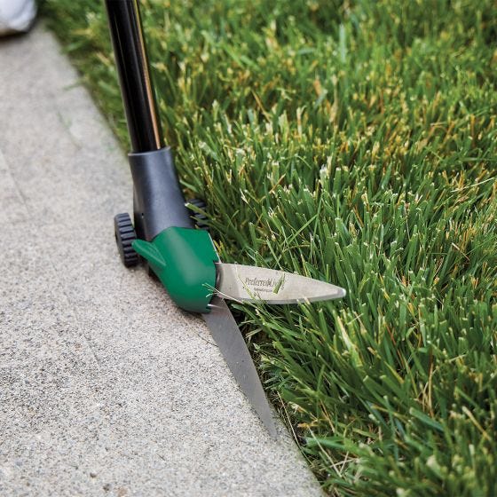 grass shears in use up close