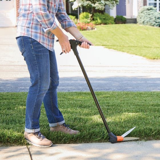 model using grass shears outside 