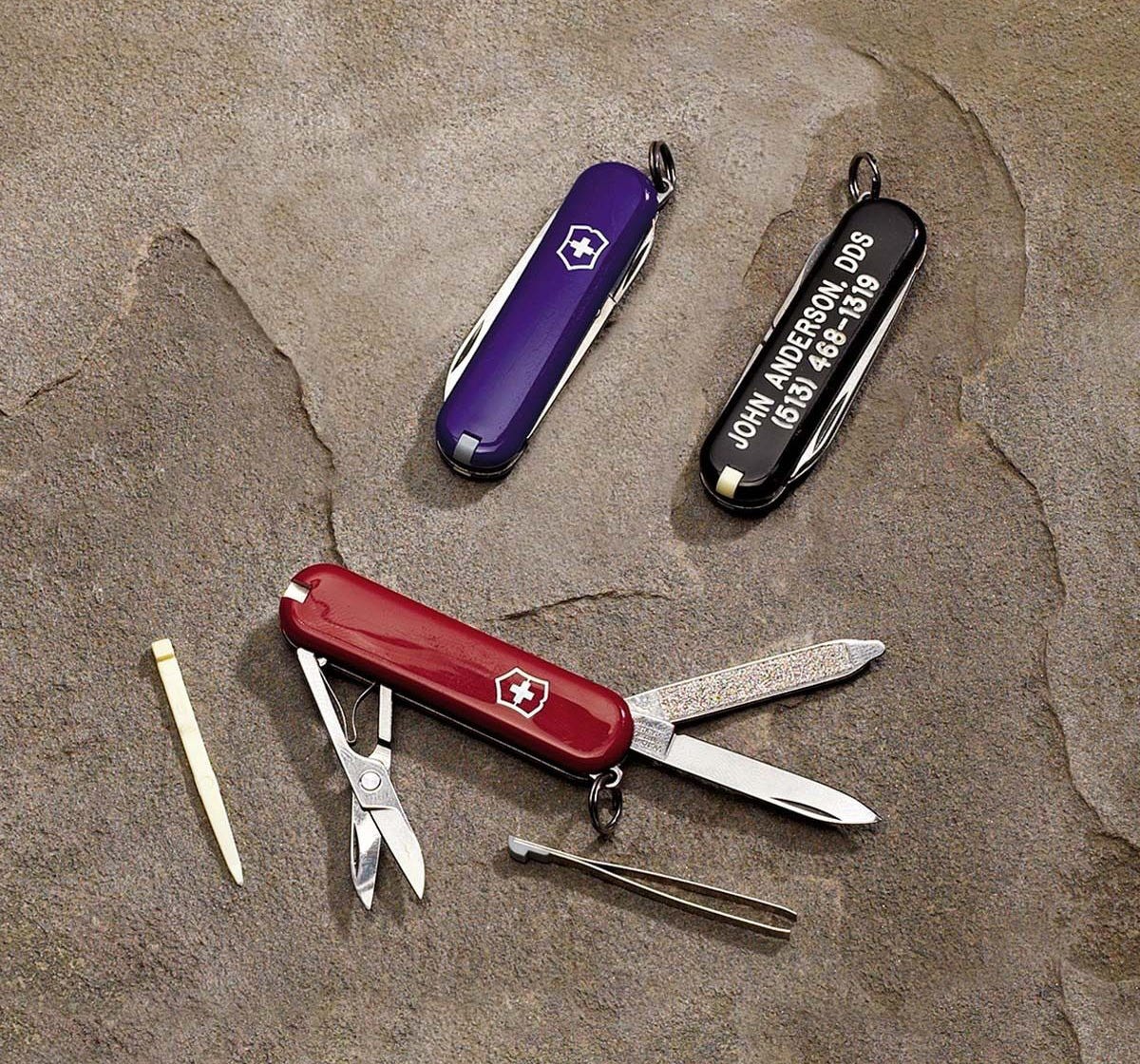 red, blue and black swiss army knives