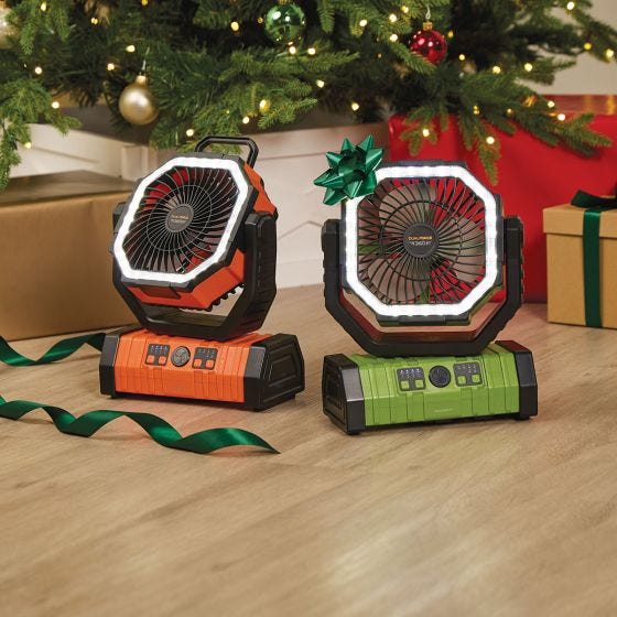 orange and green work light and fan turned off under christmas tree